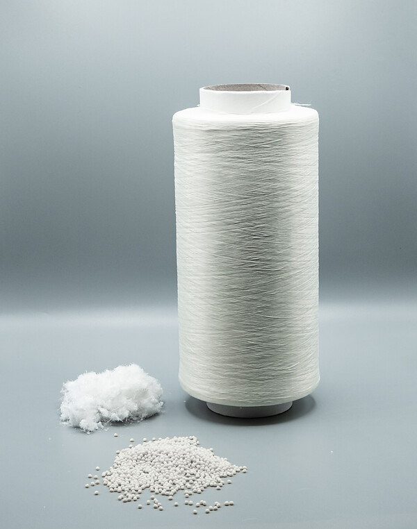 <b>Recycling, thinner than human hair –  the 100 %  rPET fibre.</b>
Fibre waste from filament fibre production (left), the high-quality regranulate into which it was recycled (front) and a 100% rPET fibre spun from this regranulate using filament technology (right).